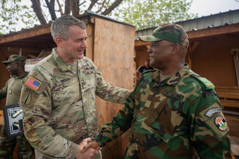 In this photo provided by the U.S. Air Force, U.S. Army Lt. Gen. Jonathan Braga, U.S. Army Special Operations commander, meets with Maj. Gen. Moussa Barmou, Niger Special Operations Forces commander, to discuss anti-terrorism policy and tactics throughout Niger, at Air Base 101, Niger, June 12, 2023. U.S. Department of Defense agencies partner with the Nigerien Army and Special Operators to bolster anti-violent extremist organization action throughout Northwest Africa. (Staff Sgt. Amy Younger/U.S. Air Force via AP)