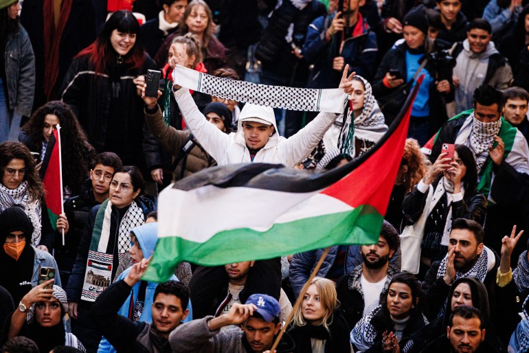 epa10945743 A participant holds a keffiyeh scarf during a protest in solidarity with people in Gaza, in Kreuzberg district of Berlin, Germany, 28 October 2023. Various organizations called for the rally under the motto 'Global South United!'. Thousands of Israelis and Palestinians have died since the militant group Hamas launched an unprecedented attack on Israel from the Gaza Strip on 07 October, and the Israeli strikes on the Palestinian enclave which followed it. EPA-EFE/CLEMENS BILAN