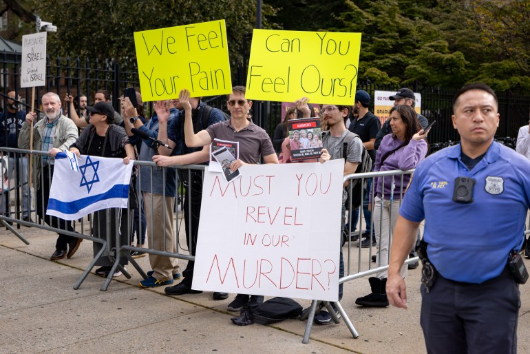 NEW YORK, UNITED STATES - 2023/10/12: Jewish counter protesters shout and waves signs at students from Brooklyn College during a pro-Palestinian demonstration at the entrance of the campus. The pro-Palestinian student organization Students for Justice In Palestine (SJP) held protests in colleges across the nation to show solidarity with Palestine. On October 7 the Palestinian militant group Hamas launched a large-scale surprise attack from Gaza, launching thousands of missiles and sending at least 1,500 fighters by land, sea and air into Israel. At least 1,300 Israelis have been confirmed killed and 150 kidnapped. 1,203 Palestinians in Gaza are also confirmed killed. The attack is prompting retaliatory strikes by Israel on Gaza and a declaration of war by the Israeli prime minister. (Photo by Michael Nigro/Pacific Press/LightRocket via Getty Images)