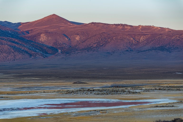 USA, California, Mono County, Mammoth Lakes, A view across the LongValley Caldera at sunset to the volcanic crater rim known as the Glass Mountain Range.