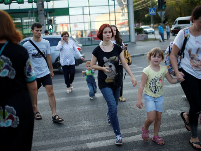 People cross the street in Volgograd, Russia, July 21, 2017. REUTERS/David Mdzinarishvili