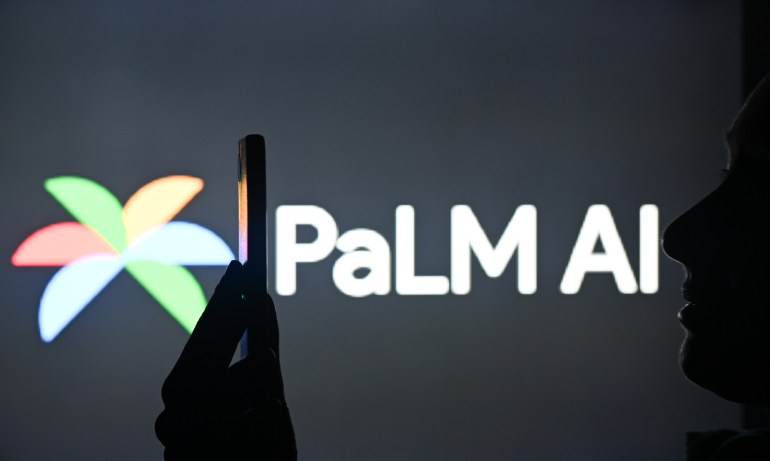 EDMONTON, CANADA - APRIL 28: An image of a woman holding a cell phone in front of a X logo displayed on a computer screen, on April 29, 2024, in Edmonton, Canada. (Photo by Artur Widak/NurPhoto via Getty Images)