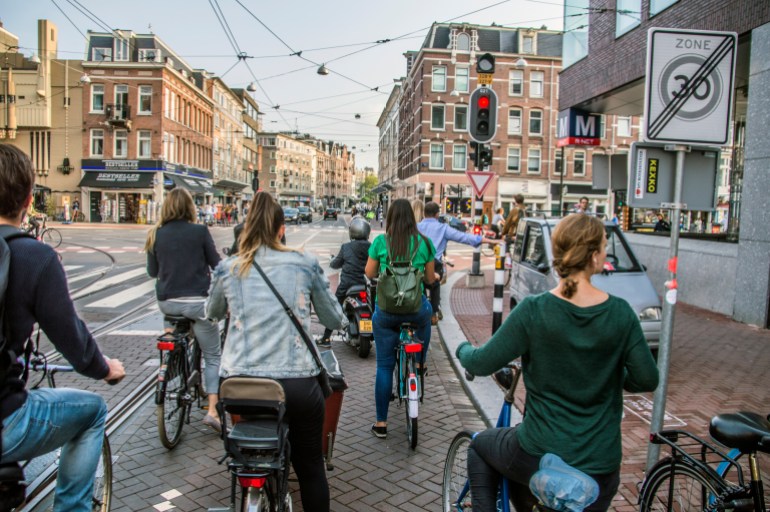 Bicycles Waiting At A Stoplight At Amsterdam The Netherlands 2018; Shutterstock ID 1180846177; purchase_order: ajnet; job: ; client: ; other: