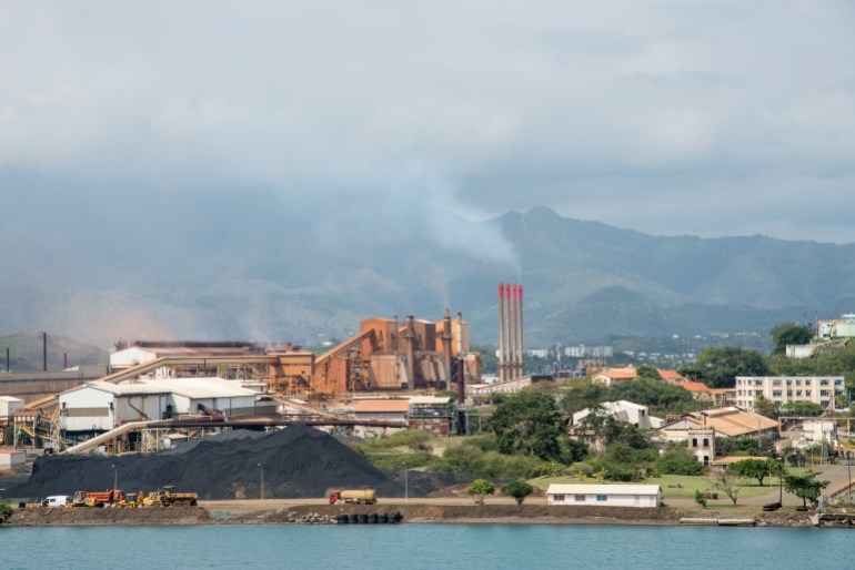 SLN Plant with smoke stack on ocean waterfront in Noumea, New Caledonia/SLN Plant/NOUMEA, NEW CALEDONIA-NOVEMBER 25,2016: SLN plant with smoke stack on ocean waterfront in Noumea, New Caledonia