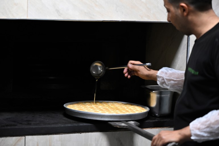 GAZIANTEP, TURKIYE - JUNE 13: Chefs prepare 'Antep baklava', the first registered Turkish product of the European Union (EU), for cooking ahead of Eid Al-Adha preparations in Gaziantep, Turkiye on June 13, 2024. Antep baklava, which a master prepares by hand in an average of 4-5 hours, is in demand both at home and abroad before Eid al-Adha. Firms are working overtime to keep up with the demand. (Photo by Adsz Gunebakan/Anadolu via Getty Images)