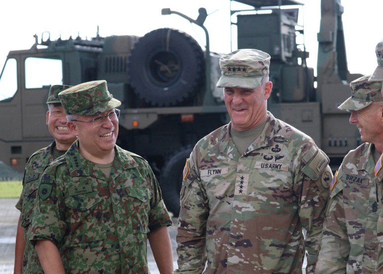 U.S. Army Pacific Commanding General Charles A. Flynn reacts with General Yoshida Yoshihide, Ground Self Defense Force Chief of Staff, on Amami Oshima island