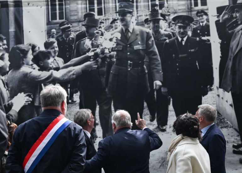 BAYEUX, FRANCE - JUNE 14: Gerard Larcher (C), President of the Senate with and Patrick Gomont, Mayor of Bayeux, during the tribute to General de Gaulle on the occasion of the 80th anniversary of the return of General de Gaulle to French soil and the restoration of the Republic institutions in Bayeux, Normandy, France, on June 14, 2024. A few days after the Normandy landings, General de Gaulle arrived in Bayeux on June 14, 1944, to counter American administration plans, and his enthusiastic reception affirmed his legitimacy, allowing the provisional government to take control in Paris after its liberation.