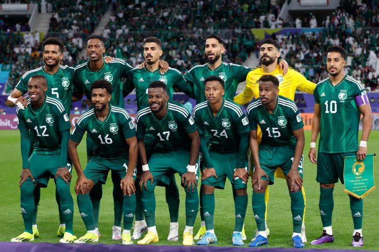 (Top L to R) Saudi Arabia's defender #05 Ali al-Bulaihi, Saudi Arabia's midfielder #23 Mohamed Kanno, Saudi Arabia's defender #04 Ali Lajami, Saudi Arabia's forward #11 Saleh al-Shehri, Saudi Arabia's goalkeeper #01 Nawaf al-Aqidi, Saudi Arabia's midfielder #10 Salem al-Dawsari, (bottom L to R) Saudi Arabia's defender #12 Saud Abdulhamid, Saudi Arabia's midfielder #16 Sami al-Najei, Saudi Arabia's defender #17 Hassan al-Tambakti, Saudi Arabia's midfielder #24 Nasser al-Dawsari and Saudi Arabia's midfielder #15 Abdullah al-Khaibari pose for a team picture during the Qatar 2023 AFC Asian Cup Group F football match between Saudi Arabia and Oman at the Khalifa International Stadium in Doha on January 16, 2024. (Photo by KARIM JAAFAR / AFP)