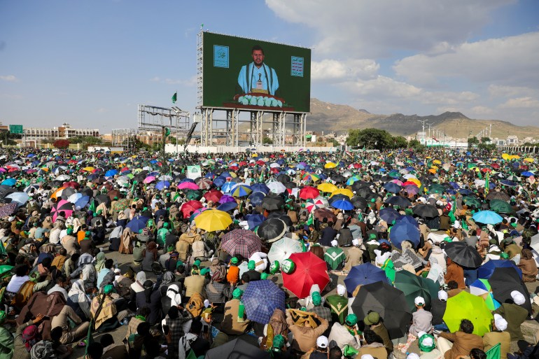 Houthi leader, Abdul-Malik al-Houthi appears on a screen during rally to mark the anniversary of the birth of the Prophet Mohammad and to show solidarity with Palestinians in the Gaza Strip, in Sanaa, Yemen, September 15, 2024. REUTERS/Khaled Abdullah