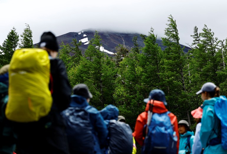 Climbers gather on the first day of the climbing season at Fuji Yoshidaguchi Trail (Yoshida Route) at the fifth station on the slopes of Mount Fuji, in Fujiyoshida, Yamanashi Prefecture, Japan July 1, 2024. REUTERS/Issei Kato