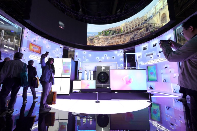 Attendees take photos in a Samsung Electronics SmartThings display during CES 2025, an annual consumer electronics trade show, in Las Vegas, Nevada, U.S. January 8, 2025. REUTERS/Steve Marcus