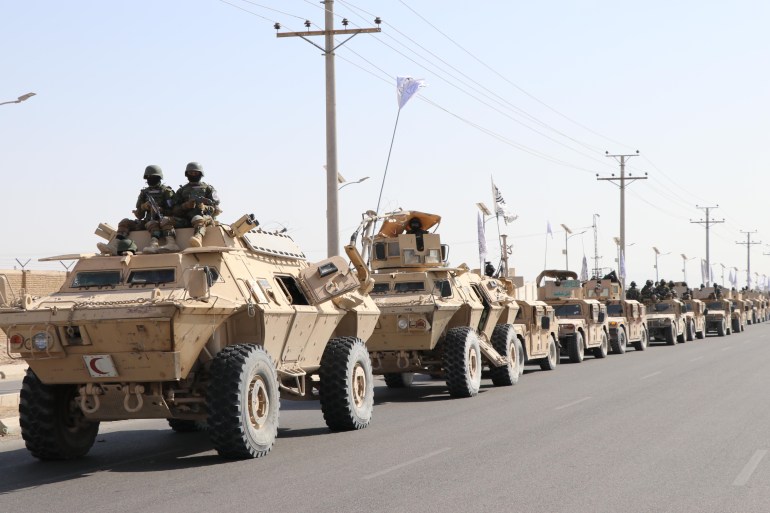 KANDAHAR, AFGHANISTAN - AUGUST 14: A military parade is being held as Members of Taliban led government, as well as many Afghan people participate in celebrations marking the 3rd anniversary of the Taliban rule in Kandahar, Afghanistan on August 14, 2024. (Photo by Mohammad Noori/Anadolu via Getty Images)