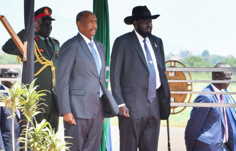 Sudan's Sovereign Council Chief General Abdel Fattah al-Burhan stands with South Sudanese President Salva Kiir upon arriving at the Juba International Airport, in Juba, South Sudan September 16, 2024. REUTERS/Jok Solomun