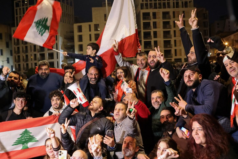 Lebanese celebrate the nomination of Prime Minister Nawaf Salam, at Martyrs' Square in Beirut, on January 13, 2025. Lebanese President Joseph Aoun on January 13, picked Nawaf Salam, the presiding judge at the International Court of Justice in The Hague, as prime minister following consultations with lawmakers, the presidency said. (Photo by ANWAR AMRO / AFP)