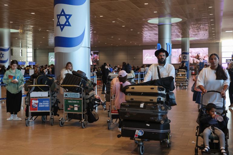 Passengers wait for flights at the Ben Gurion Airport in Tel Aviv during a nationwide strike on September 2, 2024. - Israel's main union on September 1 ordered a nationwide general strike after soldiers recovered the bodies of six killed hostages from the Gaza Strip where the military is battling Palestinian militants. (Photo by GIL COHEN-MAGEN / AFP)