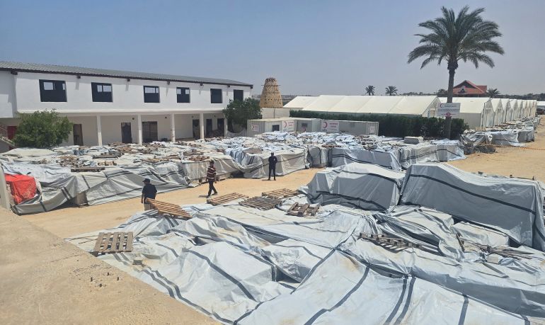 A general view of aid warehouses is pictured before an Italian delegation of political, academic, and human rights figures visits the Rafah border crossing between Egypt and the Gaza Strip, amid the ongoing conflict in Gaza between Israel and Hamas, at the North Sinai in Al Arish, Egypt, May 18, 2025. REUTERS/Stringer