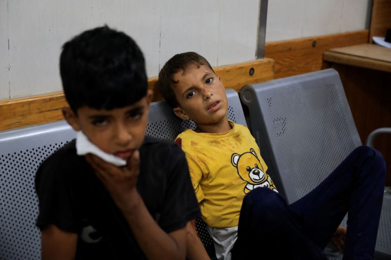 Injured Palestinian children sit on a chair at Nasser Hospital, following an Israeli strike, in Khan Younis, southern Gaza Strip, May 19, 2025. REUTERS/Hatem Khaled