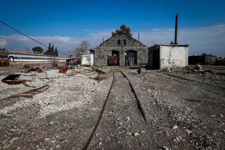 The abandoned Qadam train station, damaged during the war between rebel forces and ousted President Bashar Assad's forces, is seen in Damascus, Syria, Monday, Jan. 13, 2025. (AP Photo/Omar Sanadiki)