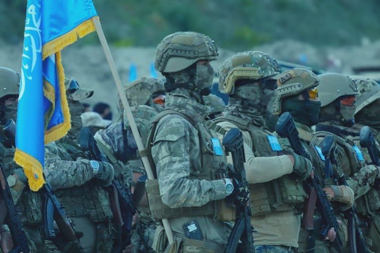 An image released by the Turkistan Islamic Party in Syria shows fighters in formation in Idlib on Sept. 28, 2024. Turkistan Islamic Party in Syria/muhsinlar.net credit : Turkistan Islamic Party