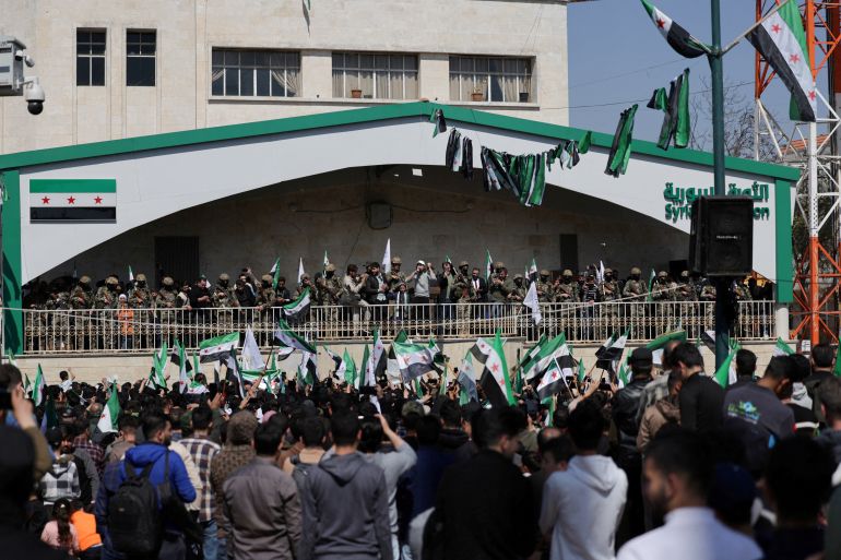 People gather during a demonstration marking the 14th anniversary of the start of the Syrian conflict, in Idlib, Syria March 15, 2025. REUTERS/Khalil Ashawi