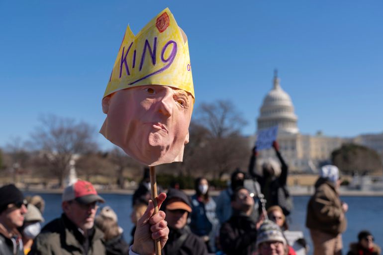 People take part in the "No Kings Day" protest on Presidents Day in Washington, in support of federal workers and against recent actions by President Donald Trump and Elon Musk, Monday, Feb. 17, 2025, by the Capitol in Washington. The protest was organized by the 50501 Movement, which stands for 50 Protests 50 States 1 Movement. (AP Photo/Jose Luis Magana)