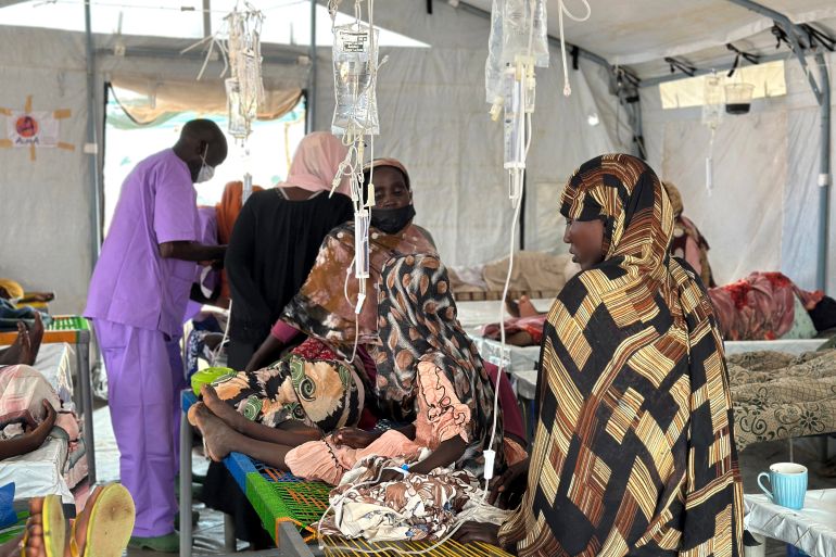 Cholera infected patients receive treatment in the cholera isolation centre at the refugee camps of western Sudan, in Tawila city in Darfur, on August 14, 2025.